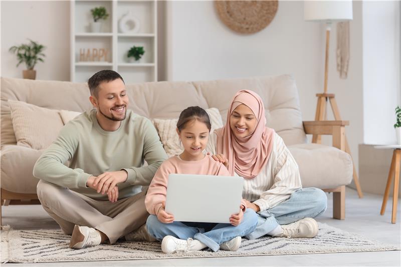 Muslim family engaging in home-based learning as part of an Islamic homeschooling routine.